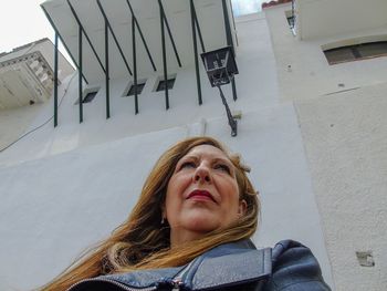 Portrait of woman standing in snow