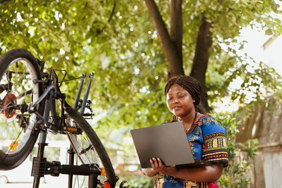 Portrait of young man using digital tablet