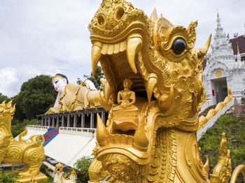 Statue of temple against building