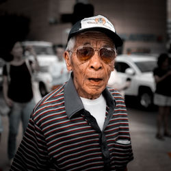 Portrait of man standing outdoors