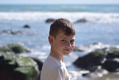 Portrait of boy smiling in sea