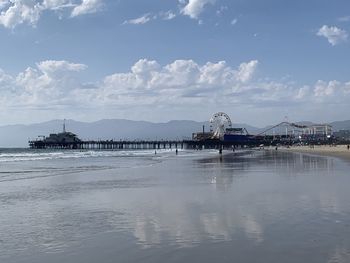 Pier over sea against sky