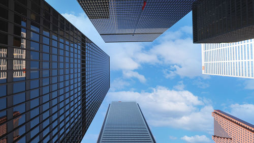 Low angle view of modern buildings against sky