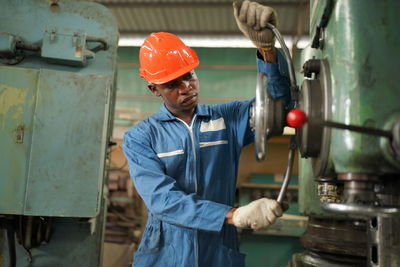 Portrait of engineer working in factory