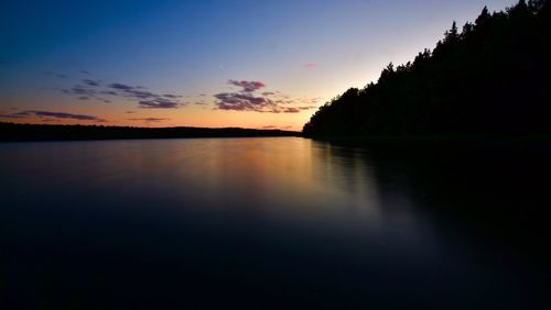 Reflection of trees in calm lake