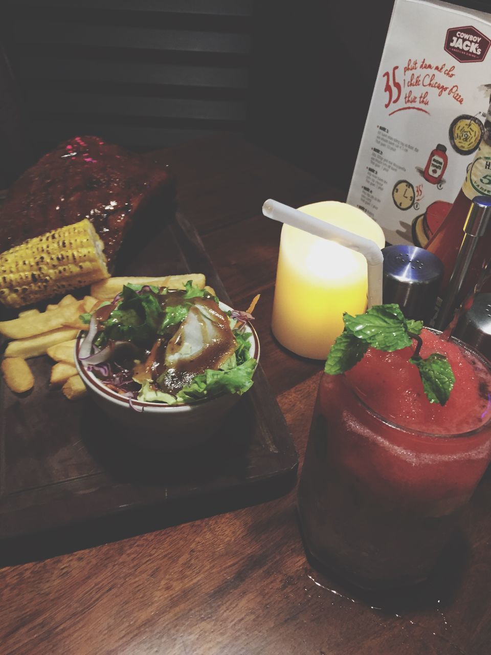 indoors, food and drink, table, freshness, food, still life, high angle view, plate, drink, ready-to-eat, healthy eating, drinking glass, refreshment, bowl, restaurant, serving size, close-up, no people, wood - material, indulgence