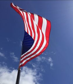 Low angle view of flag against sky