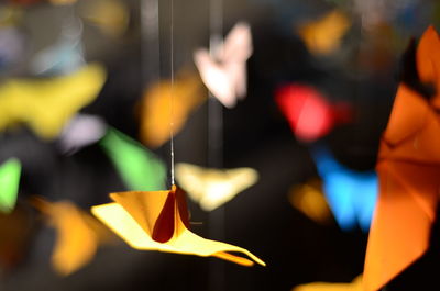 Close-up of hand holding paper toy