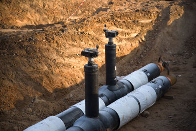 High angle view of pipe on rock