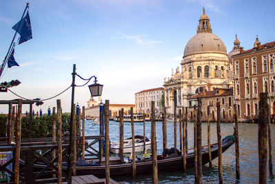 Gondola in foreground of venice canal and cathedral