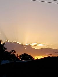 Scenic view of silhouette mountains against sky during sunset