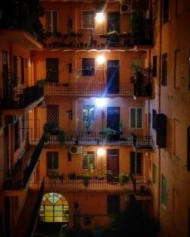 building exterior, architecture, built structure, night, illuminated, residential building, city, residential structure, building, window, street light, residential district, house, outdoors, lighting equipment, city life, apartment, no people, street, low angle view