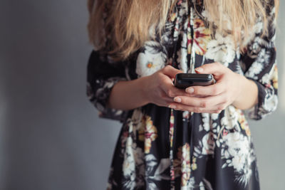 Close-up of woman using mobile phone