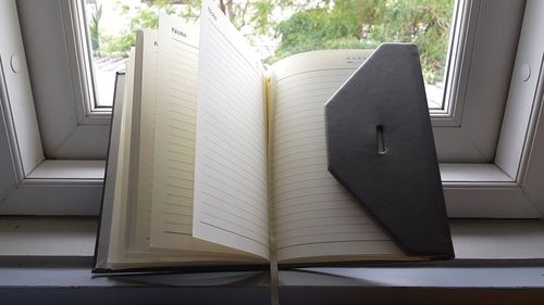 Close-up of open book at home