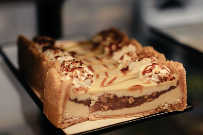 Sweet cheesecakes with caramel, nuts and cream topping