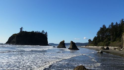 Scenic view of sea against blue sky