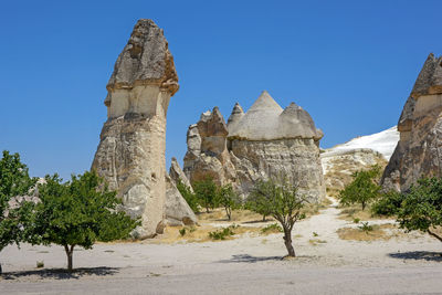 View of rock formations against clear blue sky at cappadocia, turkey
