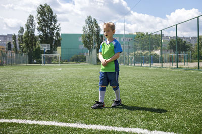 Full length of boy on soccer field