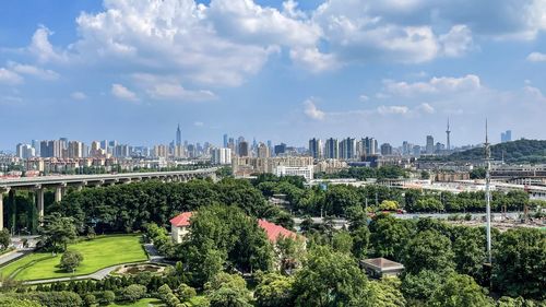 Panoramic view of city buildings against sky