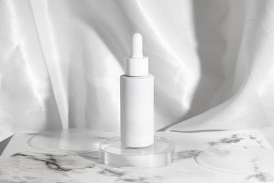 Close-up of beauty product against white backdrop