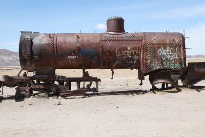 Wreck of steam engine at train cemetery