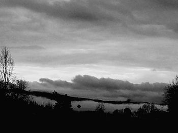 Silhouette trees against sky