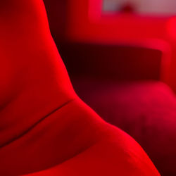 Low section of person on red chair