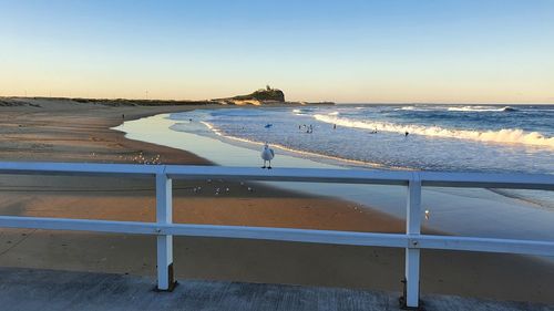 Scenic view of beach against sky during sunset