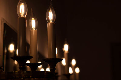 Close-up of illuminated candle lights 