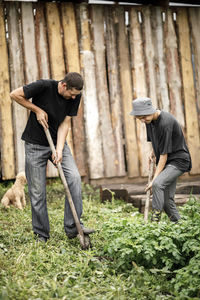 Local agriculture, farmer's day 12 october. a man in a black t-shirt with a pitchfork