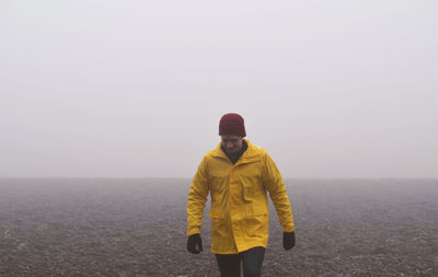 Man walking against clear sky