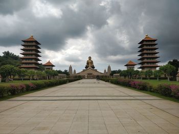 View of temple building against cloudy sky