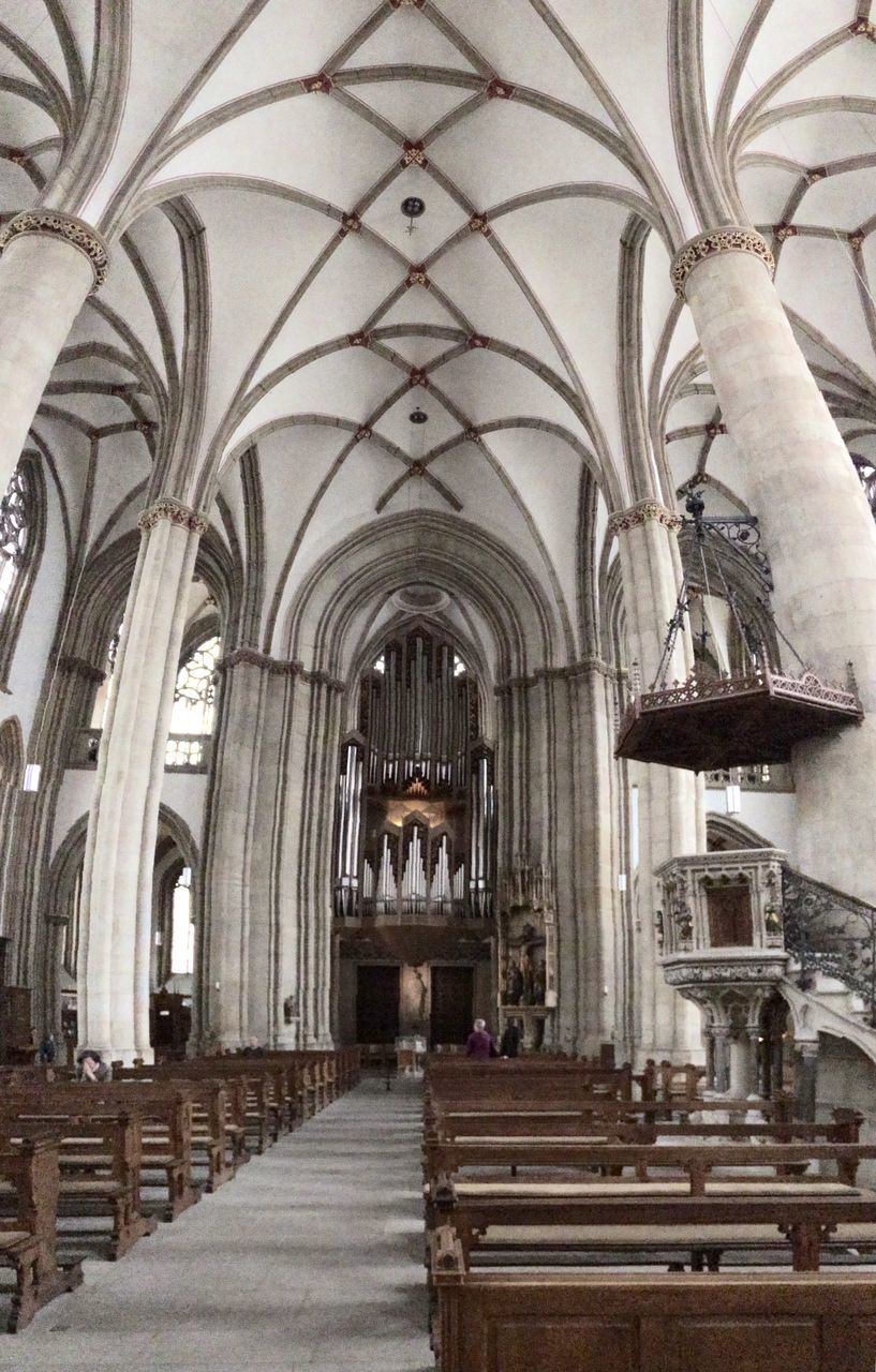 arch, indoors, religion, architecture, place of worship, built structure, spirituality, church, ceiling, the way forward, architectural column, archway, corridor, cathedral, day, in a row, incidental people, pew