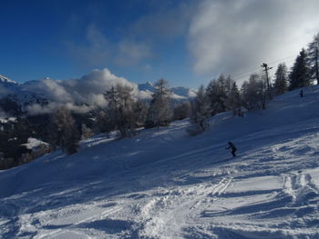 Scenic view of snow covered mountain against sky