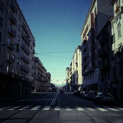 Road leading towards buildings