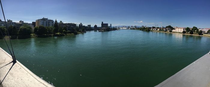 High angle view of river by buildings against sky