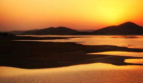 View of calm sea at sunset