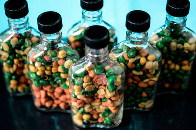 Close-up of multi colored bottles