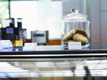 Close-up of chocolate chip cookies in jar at store