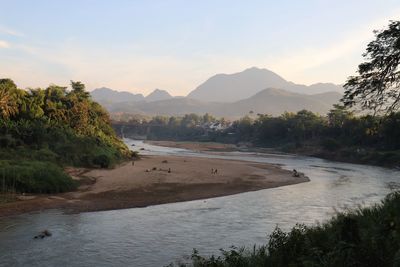 Scenic view of river against sky during sunset