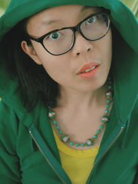 Close-up portrait of woman wearing hood