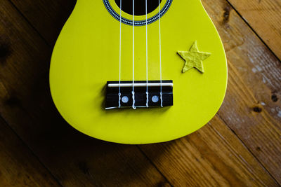 High angle view of guitar on table