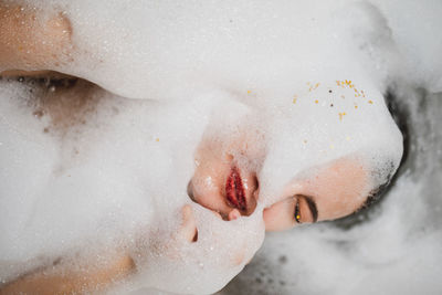 Woman taking bath in bathtub