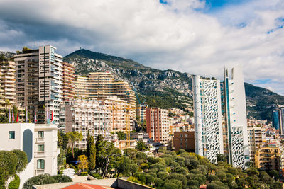 Buildings in city against sky