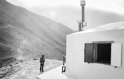 Full length of woman standing on mountain