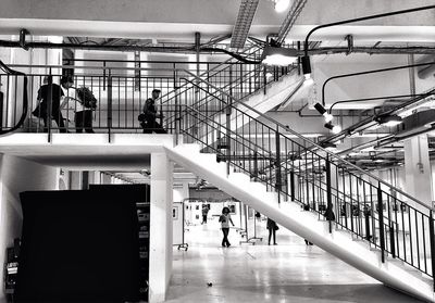 Low angle view of people in shopping mall