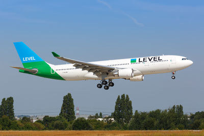 Airplane flying against clear blue sky