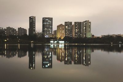 Reflection of city in water at night