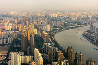 High angle view of illuminated buildings in city against sky