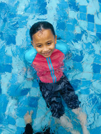 High angle view of girl swimming in pool